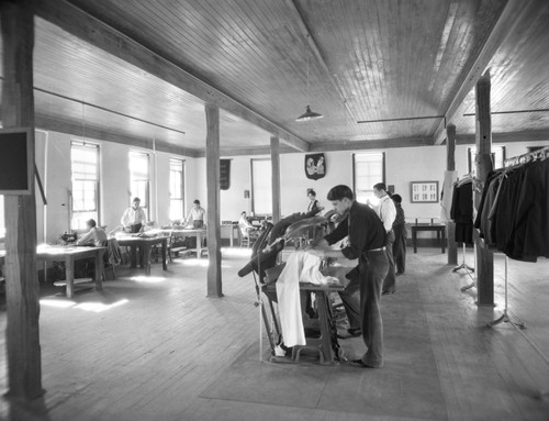 Students working in tailor shop