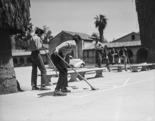 Students playing shuffleboard