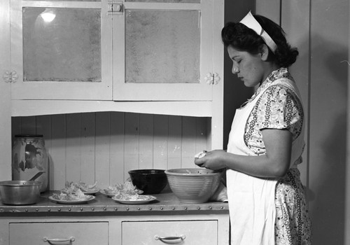 Student cooking in kitchen