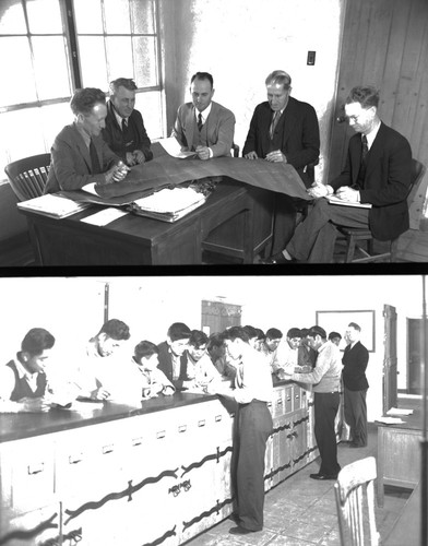 Faculty members discussing architect plans and students at counter