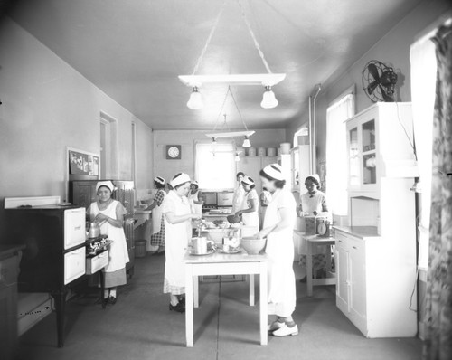 Students making food in kitchen