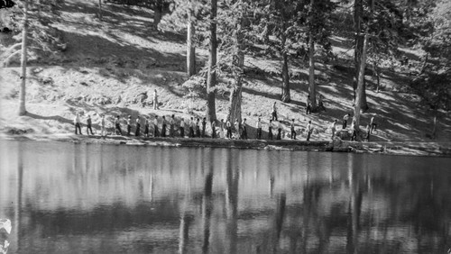 Students walk along lakeshore