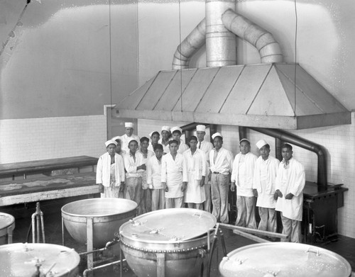 Student cooks in an industrial kitchen