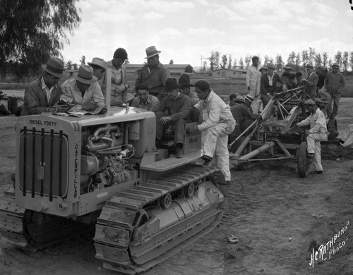 Students and faculty on tractor