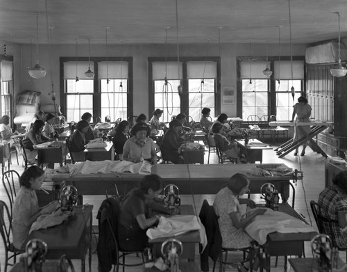 Students sewing in class