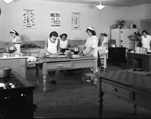 Students making food in kitchen