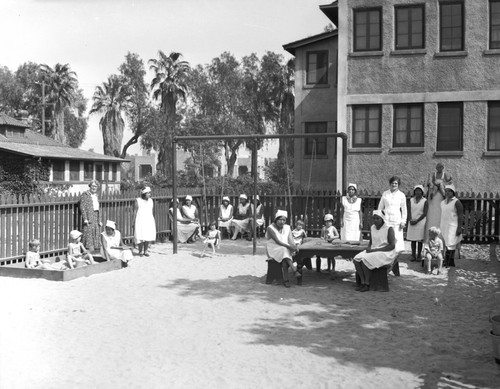 Students watching children play