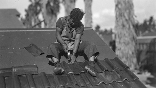 Student tiles roof