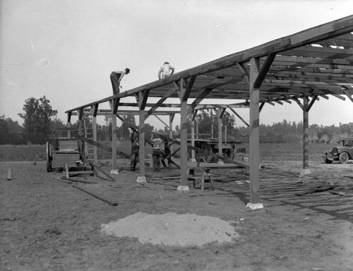 Construction workers constructing building