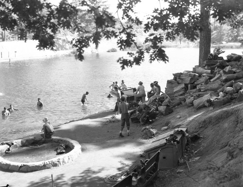 Students playing at lake