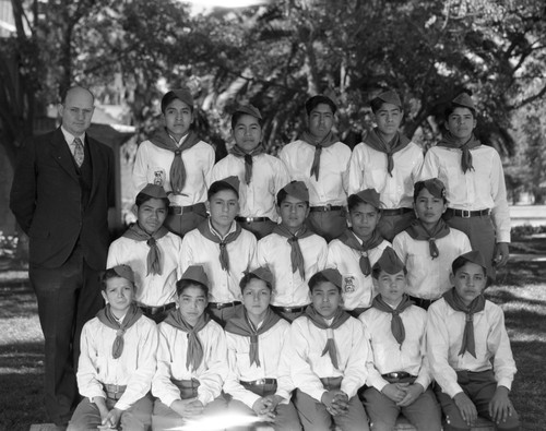 Group portrait of faculty member and Boy Scouts