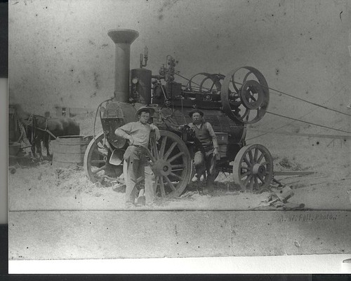 Small threshing machine and the owner, Frank Douglas, in Castroville California, PH376 © California Artichoke Advisory Board, Castroville, California