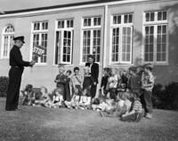 1950s - Crossing guard teaching young children street safety