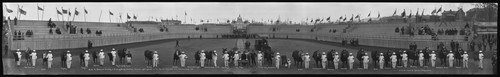 Anita M. Baldwin's display of thoroughbreds, Arabians, Percherons, Jacks & Jennets [donkeys]. [Horses and trophies in horse show at the Stock Exhibit Stadium, with the rear of the Massachusetts Building in the background.]