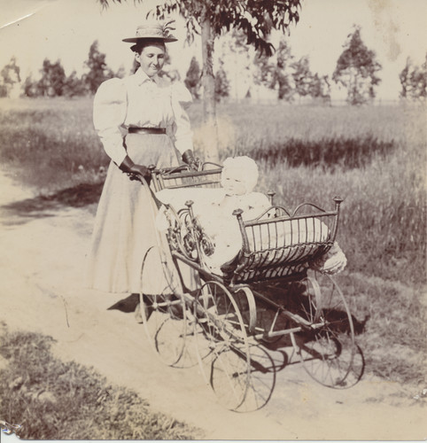 Older sister pushing baby sister down 13th Avenue