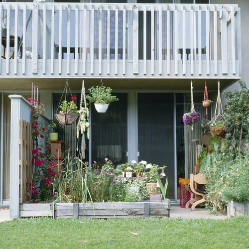 Residential Apartments, Phase One: exterior: detail of single patio and balcony above