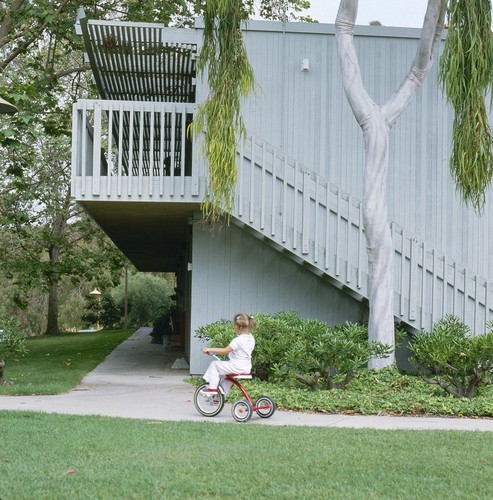 Residential Apartments, Phase One: exterior: side of one building showing balconies and stairs