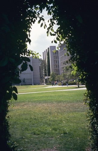 John Muir College: Electrophysics Research Building: exterior: distant view from the east and from inside the concrete supports of the Sun God