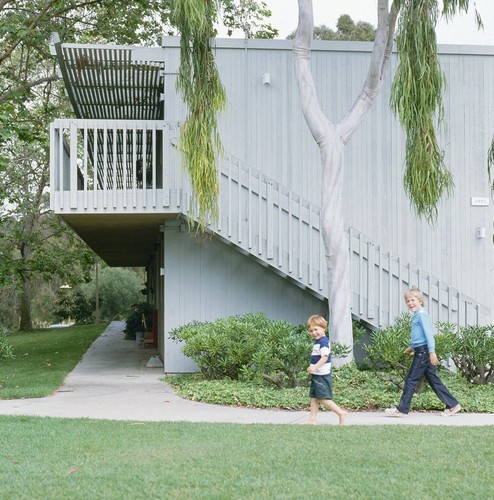 Residential Apartments, Phase One: exterior: side of one building showing balconies and stairs