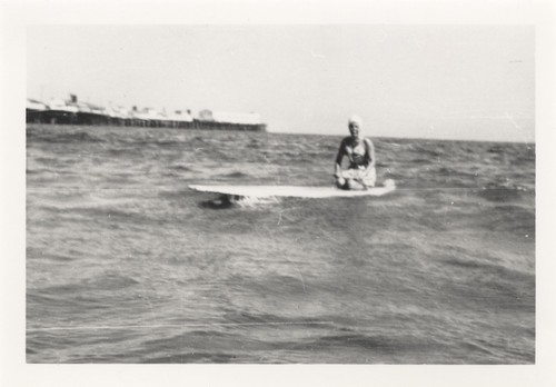 Sally Coen on surfboard