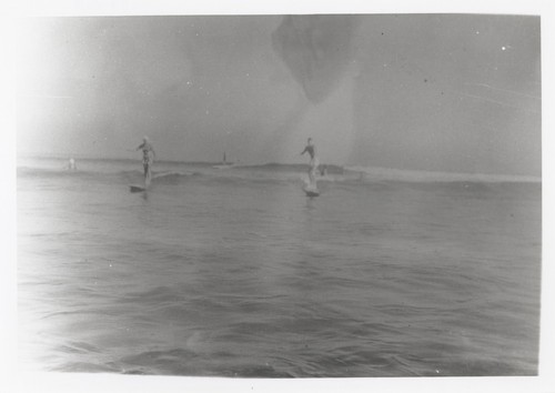 Shirley Templeman, Fred Hunt surfing at Cowell Beach