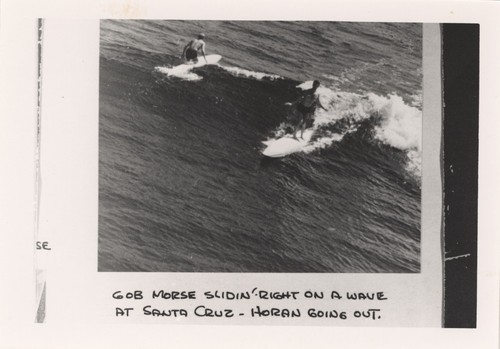 Gob Morse, Duke Horan at Steamer's Lane. Inscription: "Gob Morse slidin' right on a wave at Santa Cruz - Horan going out."