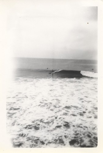 Unidentified surfers at the river point