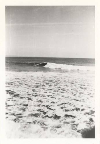 Unidentified surfers at the river point