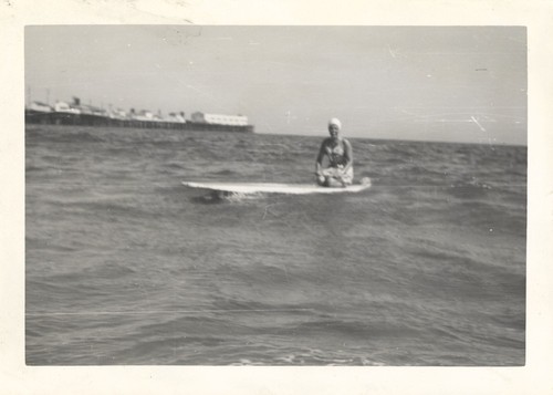 Sally Coen on surfboard