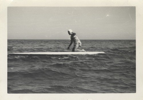 Sally Coen on surfboard