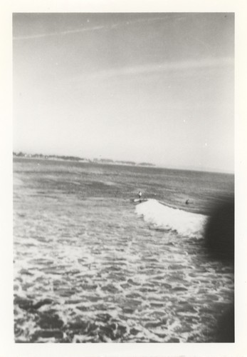 Unidentified surfers at the river point