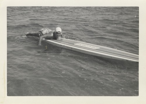 Sally Coen on surfboard