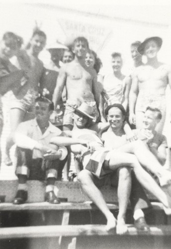 Tommy Roussel, Gerry Owens, two unidentified surfers, Bob Gillies, unidentified surfer, Carol Stanley, Emmet Thompson, Lloyd Ragon, front - unidentified surfer, Bill Lidderdale, Rich Thompson, Ed Smith at Cowell Beach