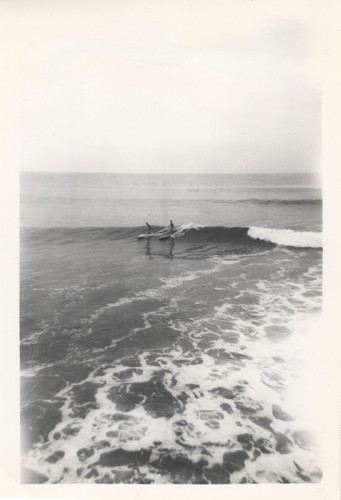 Unidentified surfers at the river point