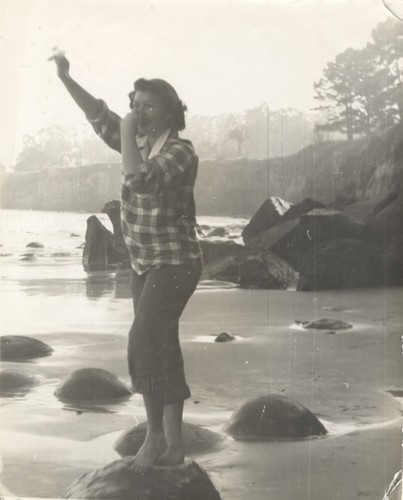 Sally Coen on rock at Cowell Beach