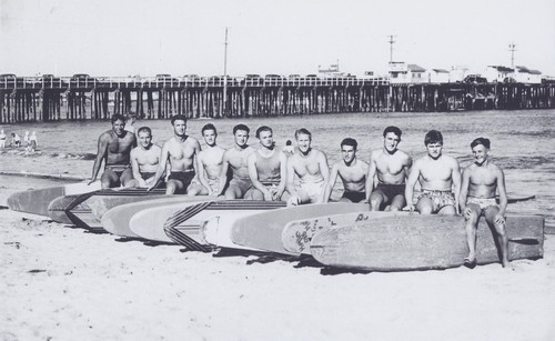 Santa Cruz Surfing Club group portrait: Don "Bosco" Patterson, Rich Thompson, Alex Hokamp, Blake Turner, Bill Grace, Dave "Buster" Steward, Fred Hunt, Harry Mayo, Alex "Pinky" Pedemonte, Tommy Roussel, Harry Murray