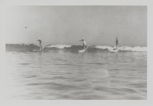 Shirley Templeman, Pat Collings, Fred Hunt surfing at Cowell Beach