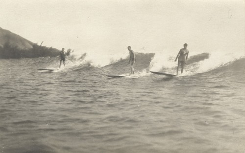 Unidentified surfers in Southern California