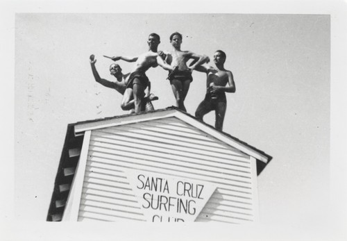 Dave "Count" Littlefield, Bob Gillies, James Alumbaugh, and Duane Polly on roof of the Santa Cruz Surfing Clubhouse, Cowell Beach