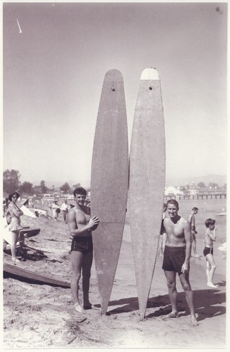 Alex Hokamp, Fred Hunt standing with surfboards at Cowell Beach