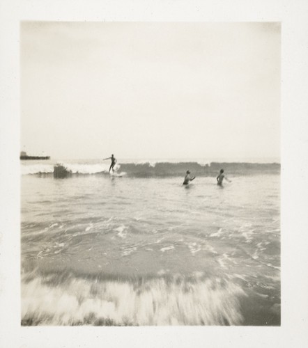 Jack Moore and two unidentified swimmers at Cowell Beach