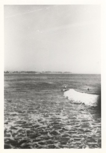 Unidentified surfers at the river point