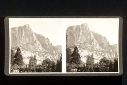 Stereoscope card (Stereographic)--Pines and building at base of cliffs in Yosemite Valley, east of Indian Canyon, Yosemite National Park, California