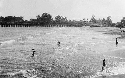 People in the waves at the Santa Cruz beach