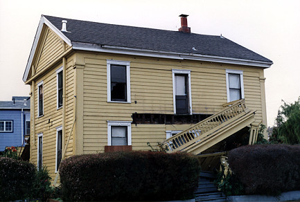 House at the corner of Elm Street and Center Street with earthquake damage