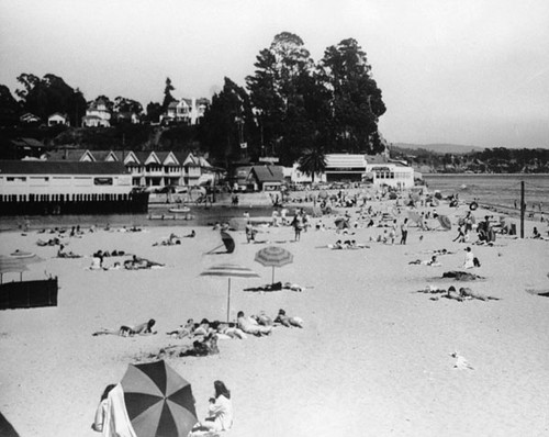 Sunbathers on the Capitola beach, with the Esplanade