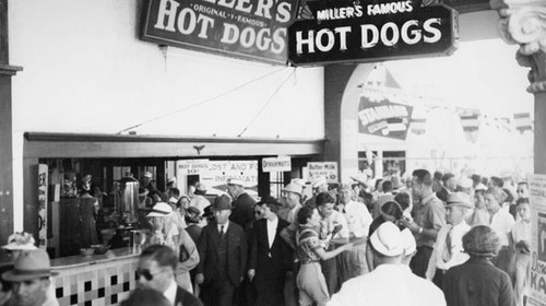Crowds at the Boardwalk, in front of Miller's Famous Hot Dogs
