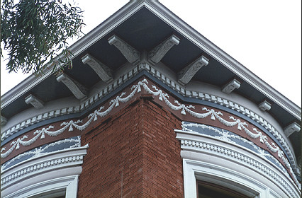 Single brick hanging on the Trust Building