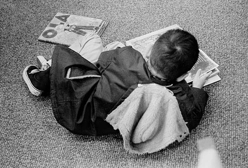 Young patron reading in the Children's Department of the Central Branch