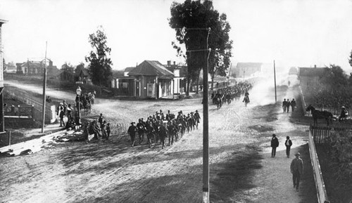 Cavalry riding down Branciforte Avenue